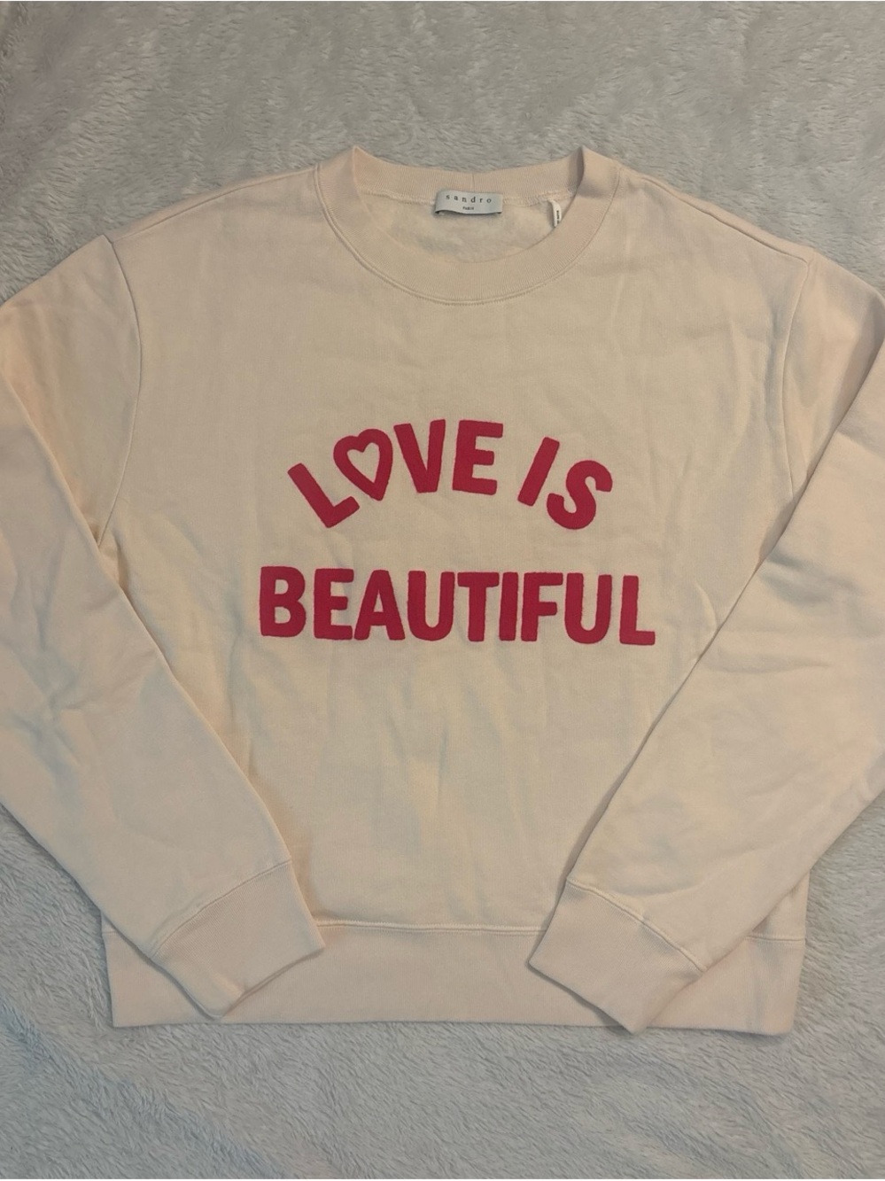Sandro Cream Crewneck Sweater with Pink 'LOVE IS BEAUTIFUL' Graphic
